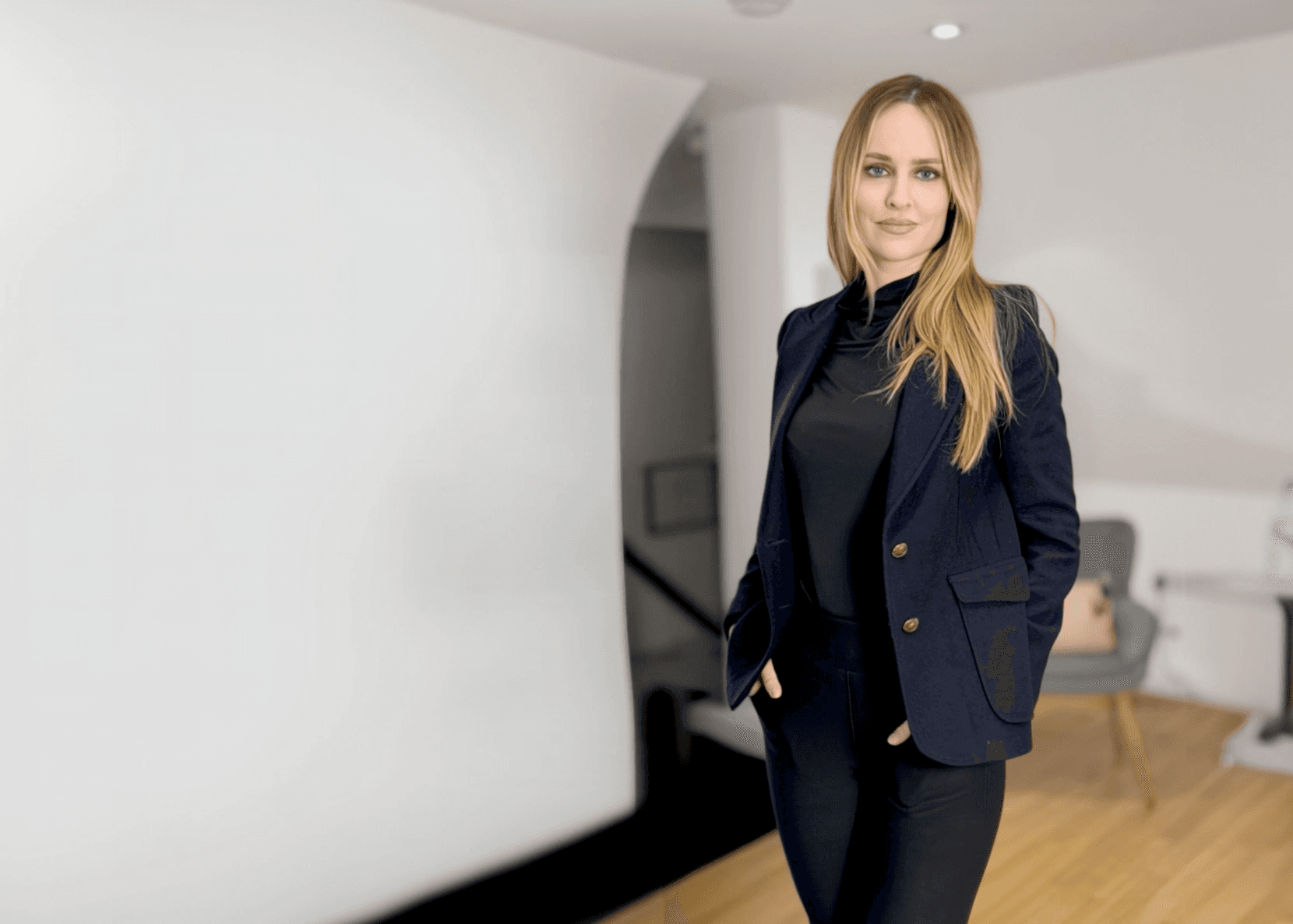 Bernadette Tobin RN MSc in a navy blazer in her clinic.